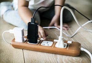 Toddler playing with plug